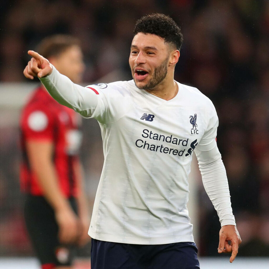 Footballer Alex Oxlade-Chamberlain in Liverpool kit enthusiastically pointing during match wallpaper