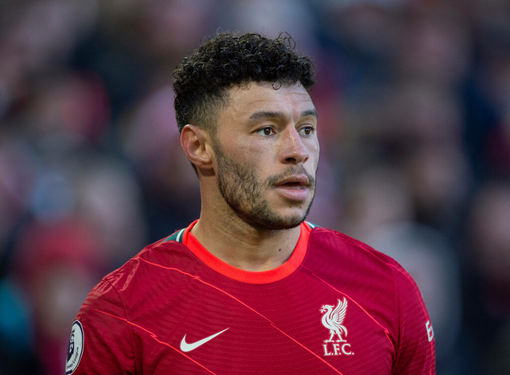 Alex Oxlade-Chamberlain in Liverpool FC kit focused during match close-up wallpaper background