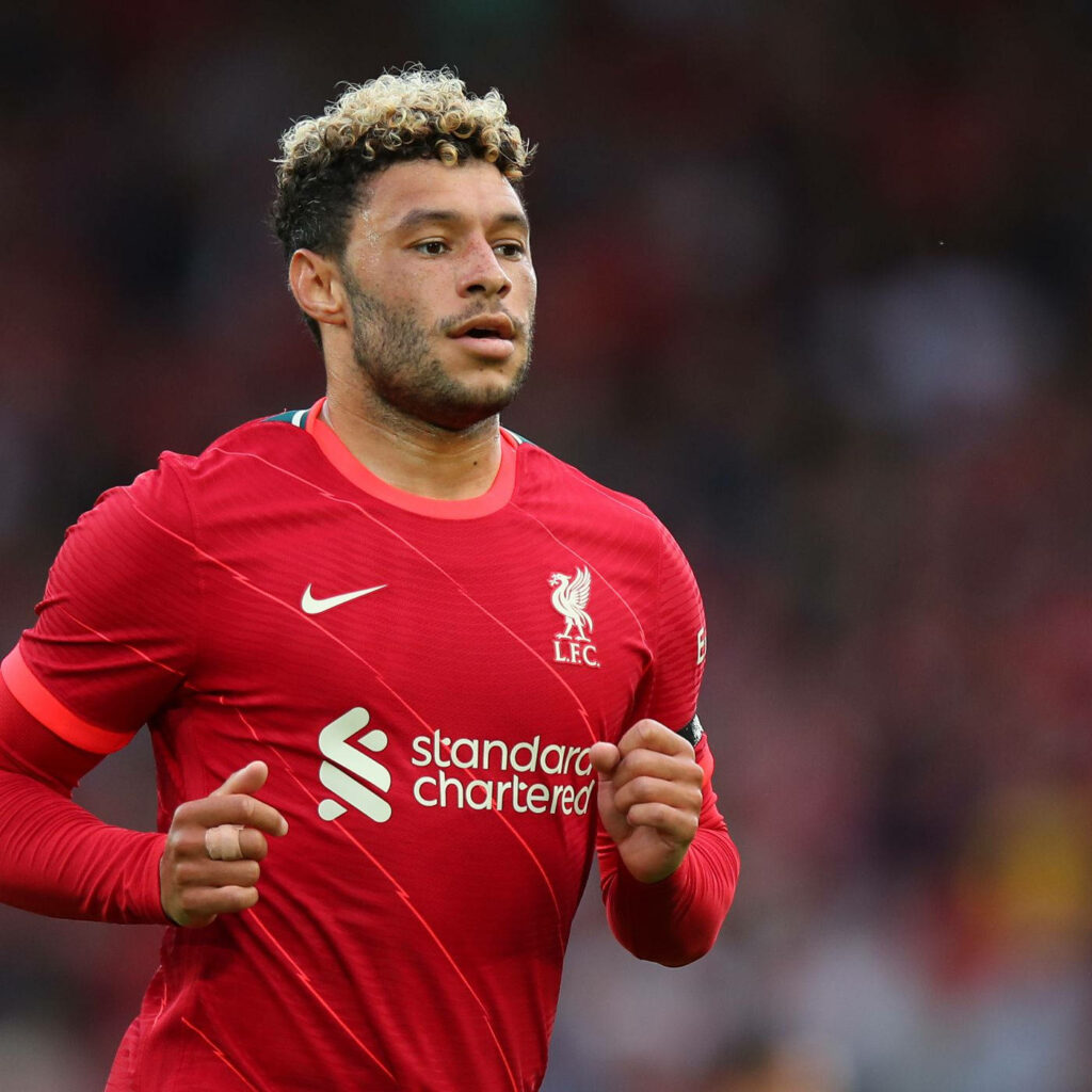 Alex Oxlade-Chamberlain in Liverpool FC home kit with blonde tips on match day wallpaper background