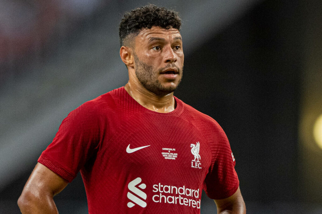 Alex Oxlade-Chamberlain in red Liverpool FC shirt focused during intense football match wallpaper