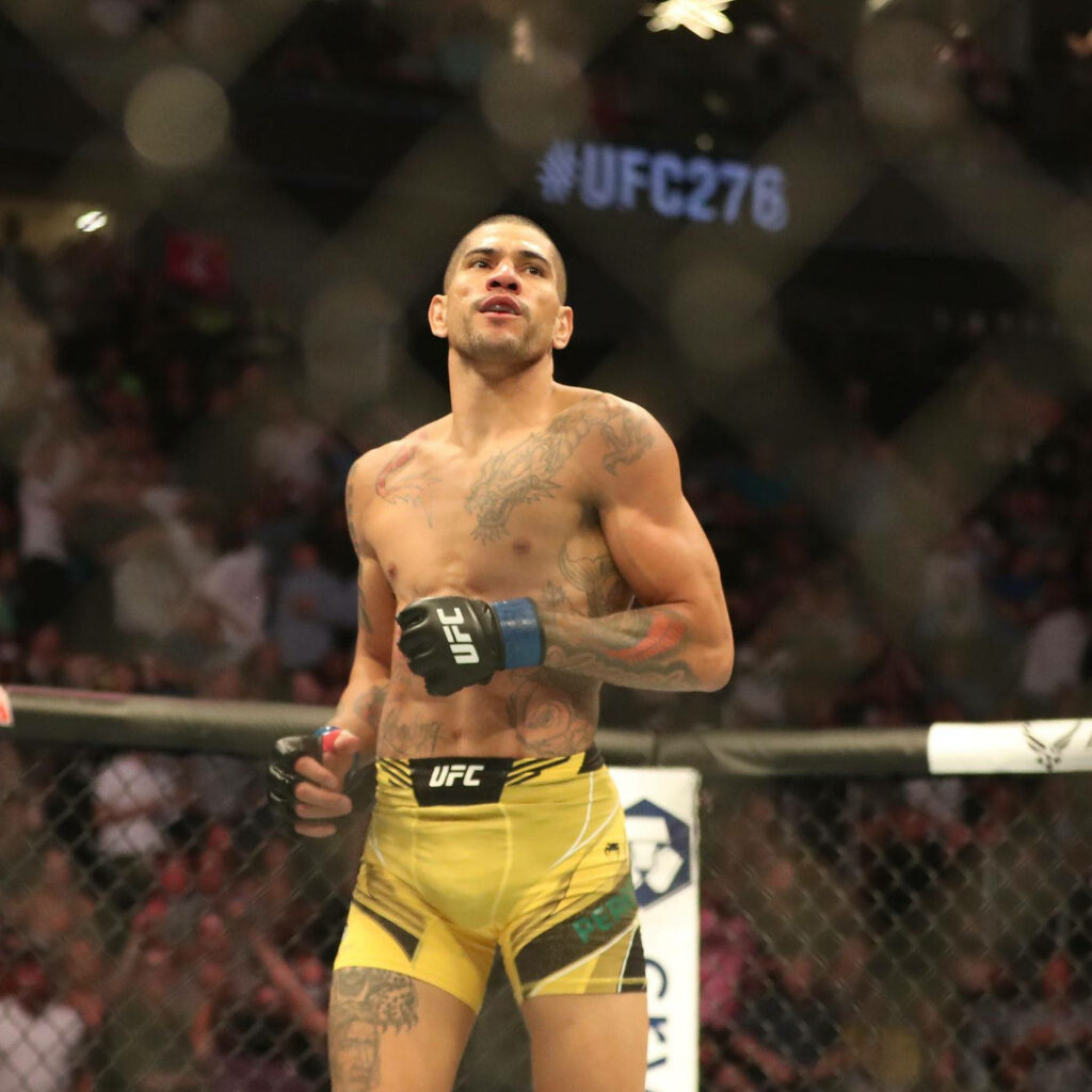 Alex Pereira jogging into UFC octagon with focused expression and vibrant crowd background wallpaper