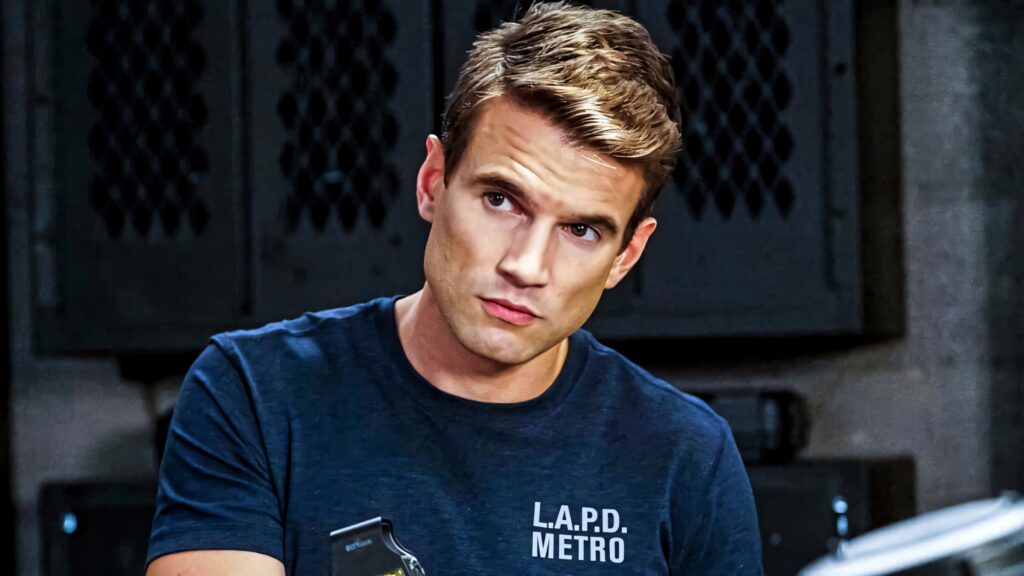Sharp portrait of Alex Russell as LAPD Metro officer in uniform showing focused professional look Wallpaper