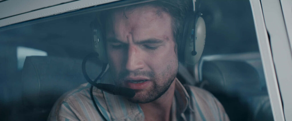 Alex Russell distressed pilot in cockpit wearing headset tense moment Pilot In Distress wallpaper background