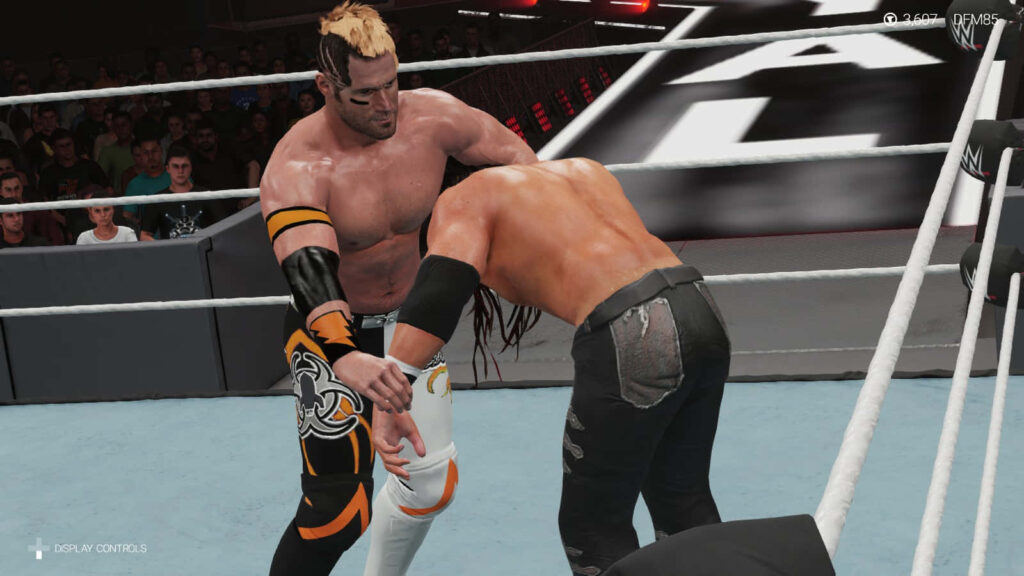 Alex Shelley battles Seth Collins WWE 2K22 intense wrestling match dynamic realistic graphics wallpaper