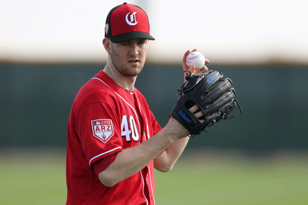 Alex Wood pitching in Cincinnati Reds uniform focused during baseball game action wallpaper