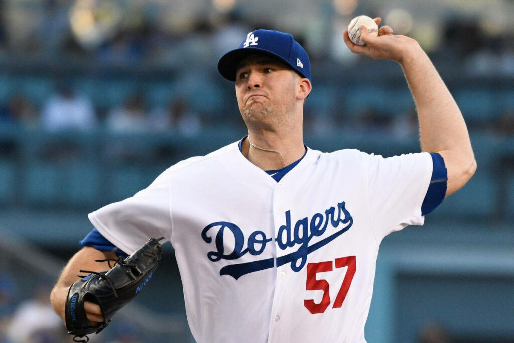 Alex Wood pitching for Los Angeles Dodgers in uniform with focused expression wallpaper background