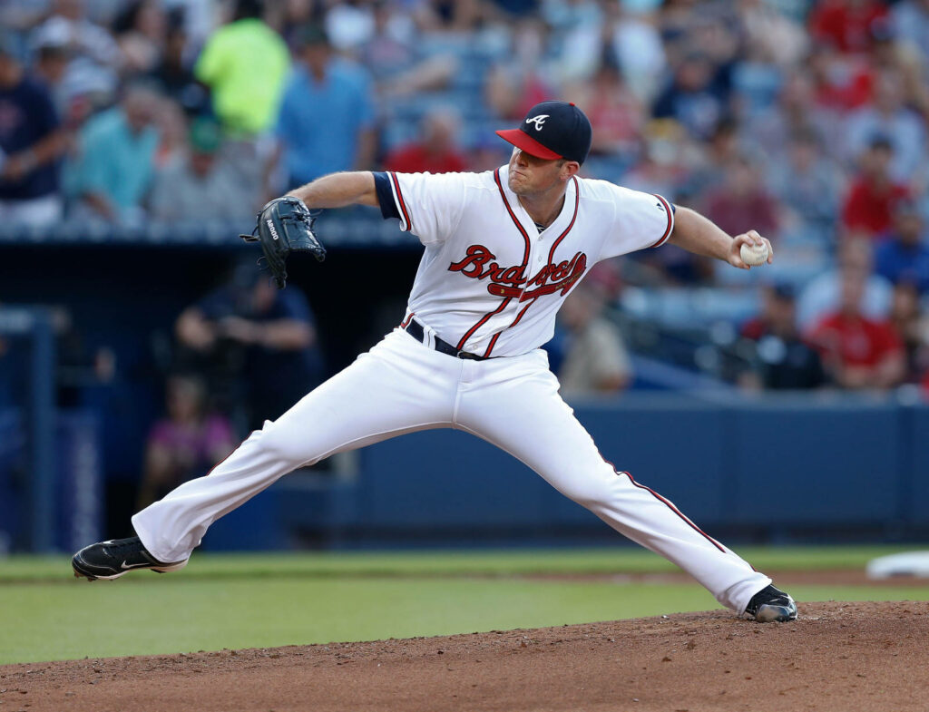 Alex Wood pitching on mound intense focused dynamic baseball action shot wallpaper background