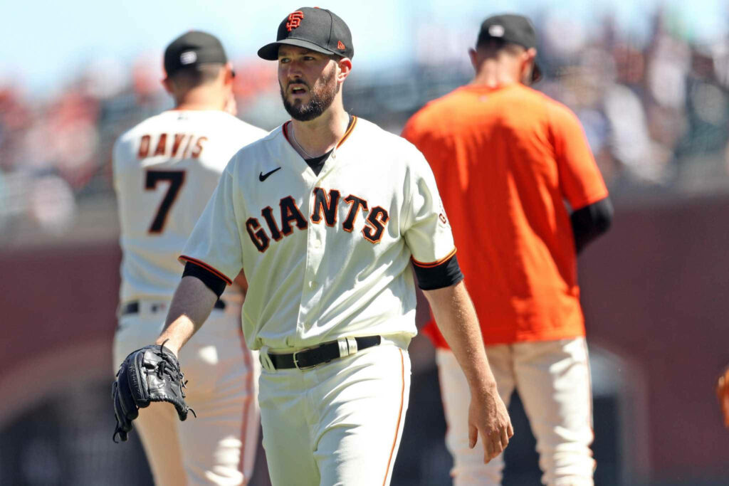 Baseball pitcher Alex Wood in San Francisco Giants uniform prepares to pitch during game wallpaper