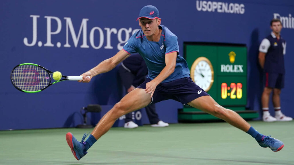 Alex de Minaur US Open tennis action split-step return showing agility and determination wallpaper