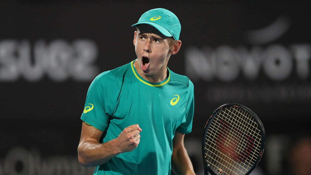Alex de Minaur tennis player celebrating intensely on court competitive spirit wallpaper background
