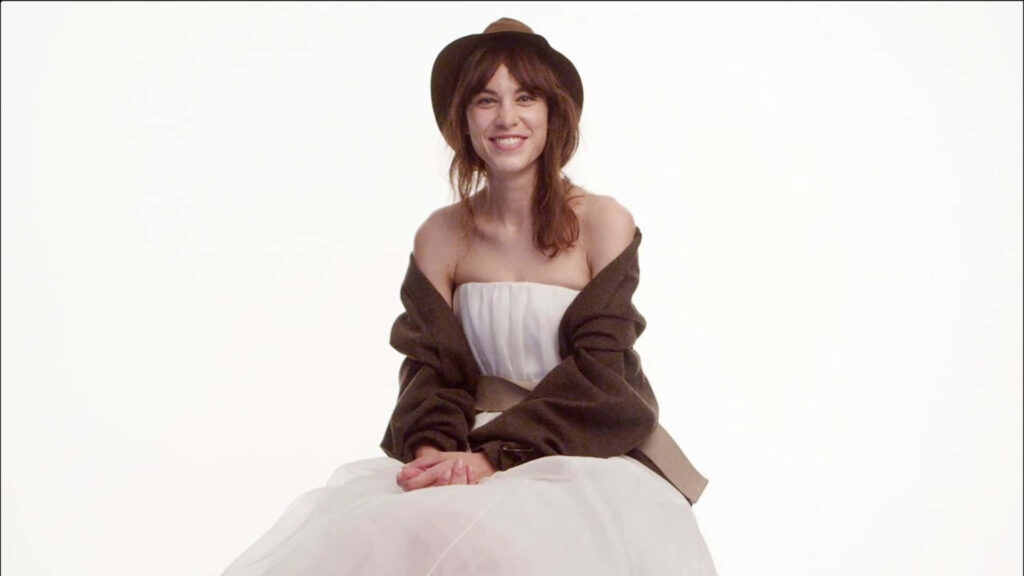 Alexa Chung smiling wearing hat elegant off shoulder dress stylish fashion wallpaper background