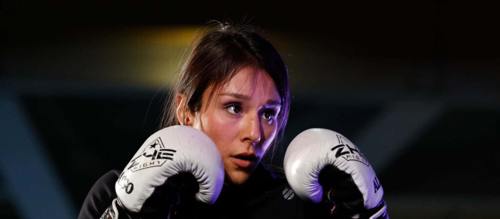 Alexa Grasso focused in boxing gloves ready to fight intense ring wallpaper background