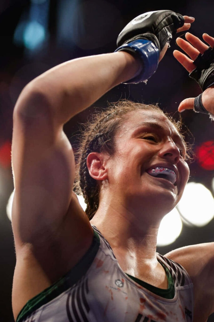 Alexa Grasso celebrates victory in the ring showing determination and fighting spirit wallpaper