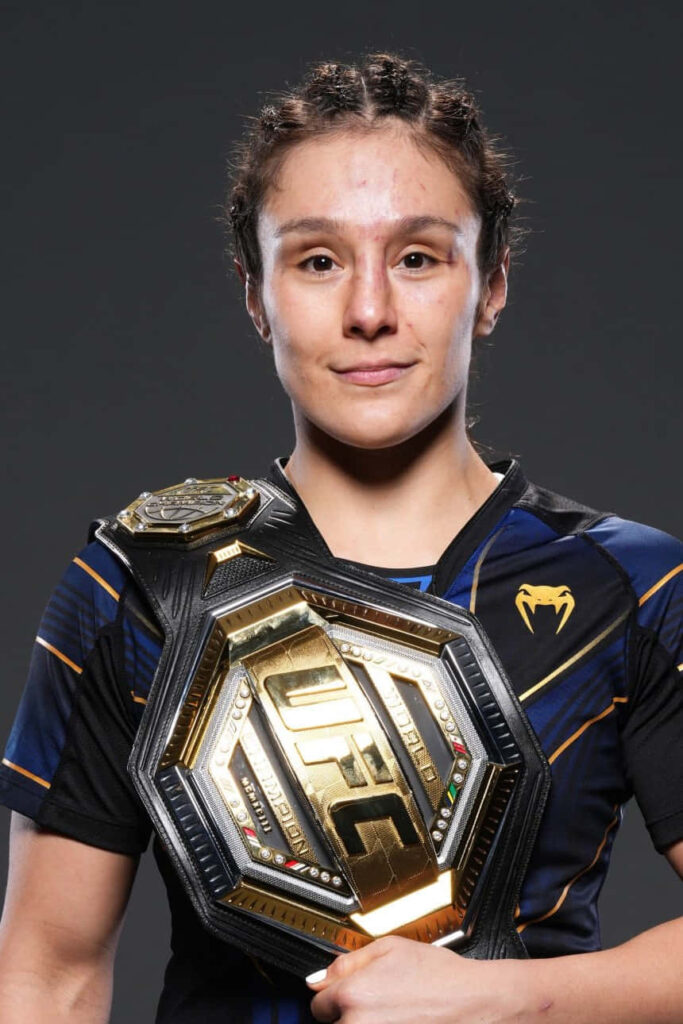 Alexa Grasso UFC champion posing with belt showing strength determination MMA fighter wallpaper
