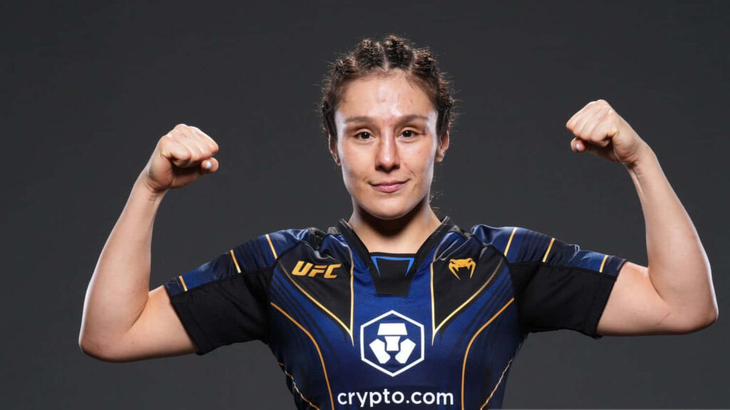 Alexa Grasso UFC fighter flexing biceps in fight kit showing strength and determination Wallpaper
