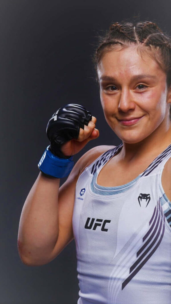 Alexa Grasso UFC fighter posing confidently in fight gear showing strength and determination wallpaper