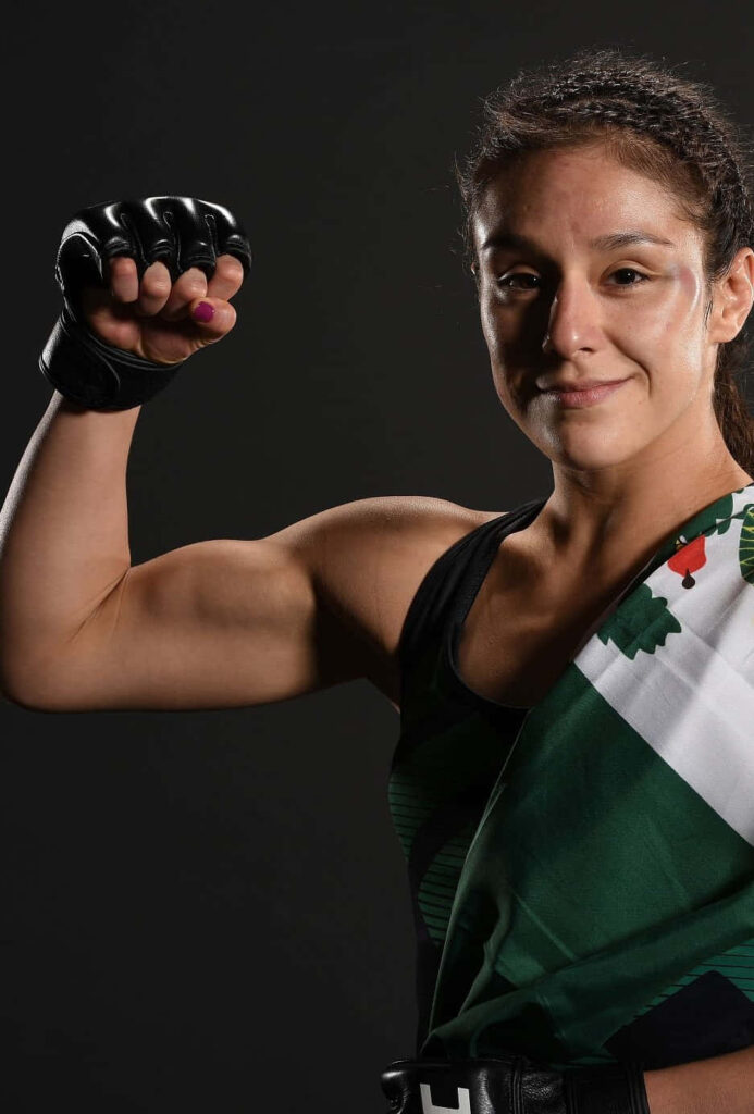 Alexa Grasso UFC fighter posing confidently with clenched fist and flag on shoulder wallpaper