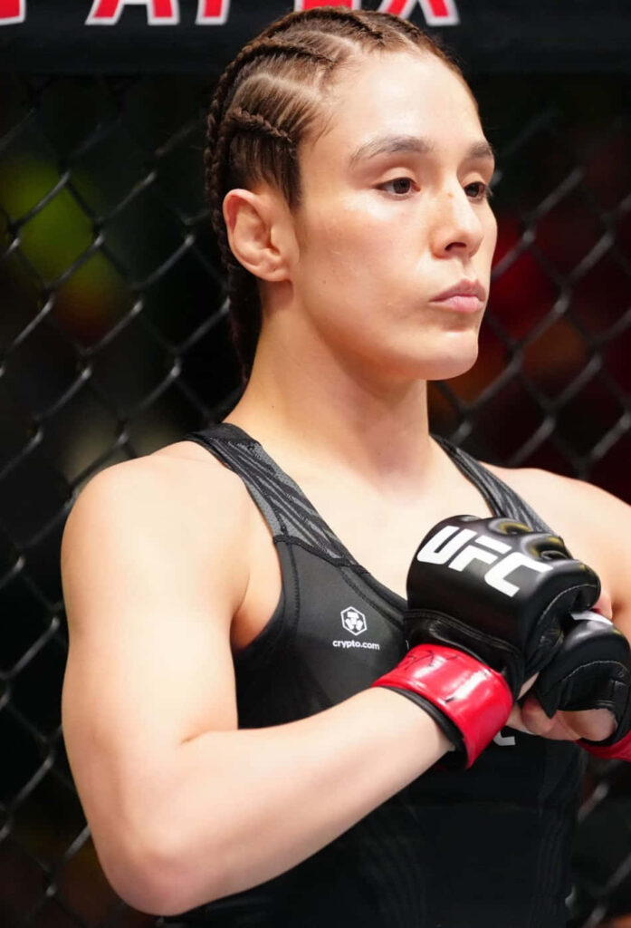 Alexa Grasso focused in UFC octagon wearing fight gear preparing for competition wallpaper