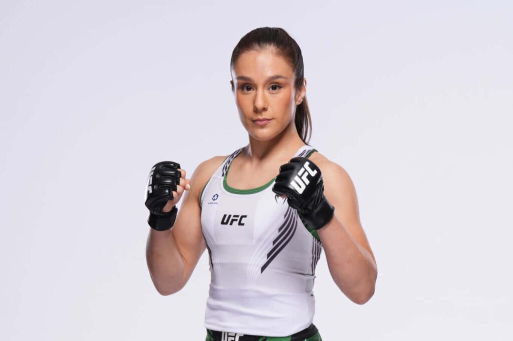Alexa Grasso poised in UFC gear ready for fight action dynamic wallpaper background image