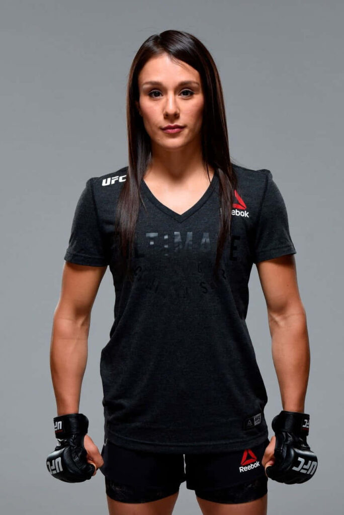 Alexa Grasso in UFC gear ready for action dynamic wallpaper background with confident pose