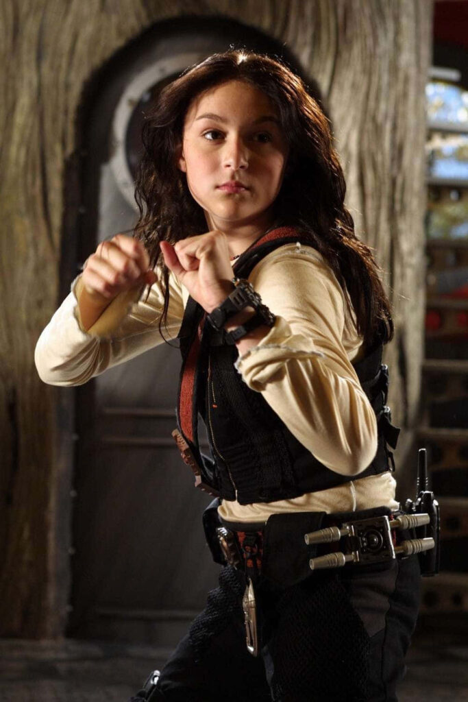 Alexa PenaVega fierce action pose adventurous wallpaper background ready for thrilling adventure