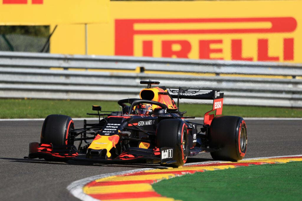 Alexander Albon Formula One car navigating sharp turn Pirelli banner racetrack wallpaper