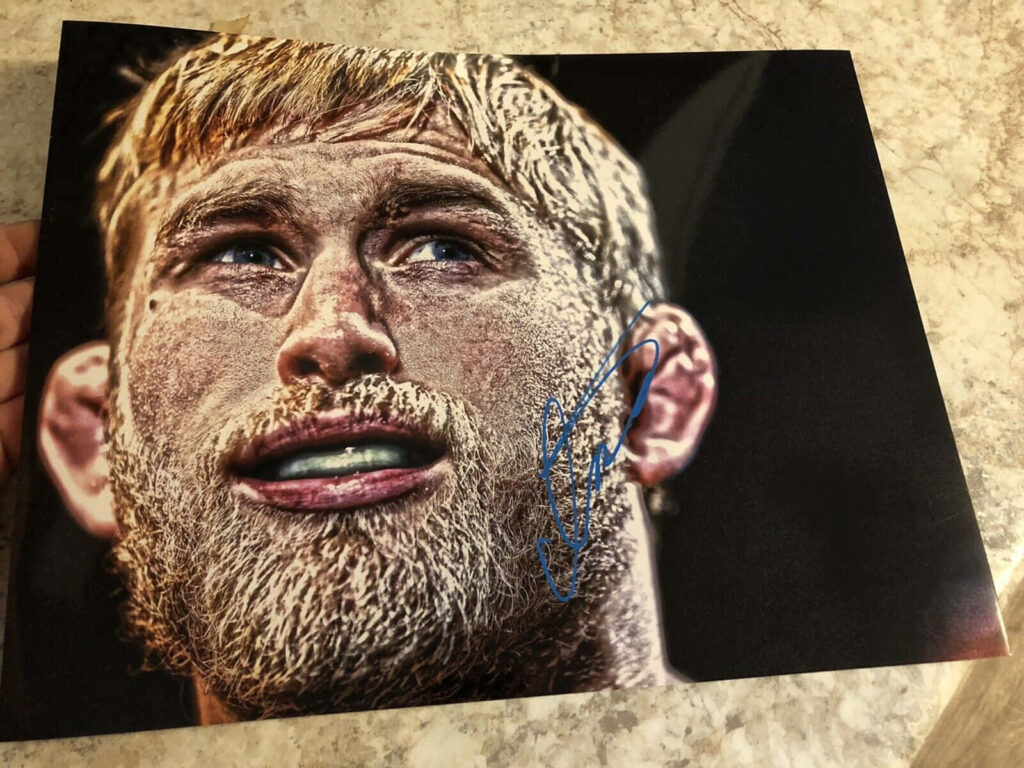 Close-up of Alexander Gustafsson showing intense focus with his autograph wallpaper background