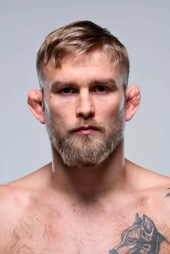 Alexander Gustafsson intense portrait profile with fighter physique on neutral wallpaper background