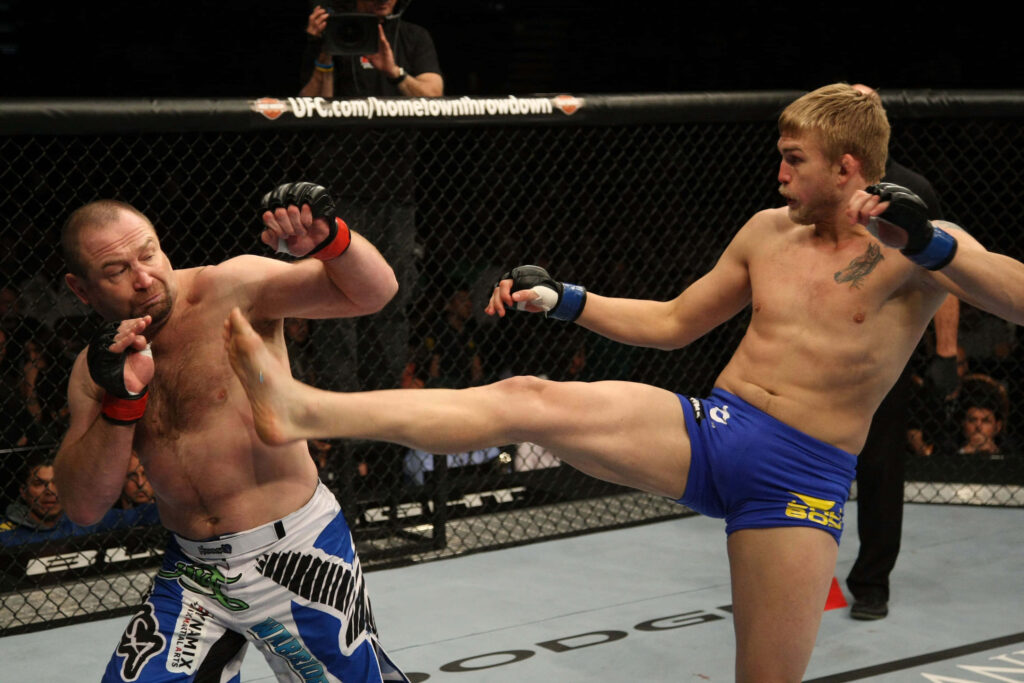 Alexander Gustafsson powerful kick Vladimir Matyushenko UFC fight intense octagon action wallpaper