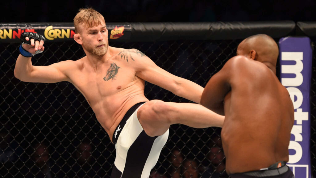 Alexander Gustafsson lands a powerful kick on Daniel Cormier intense UFC MMA fight wallpaper background