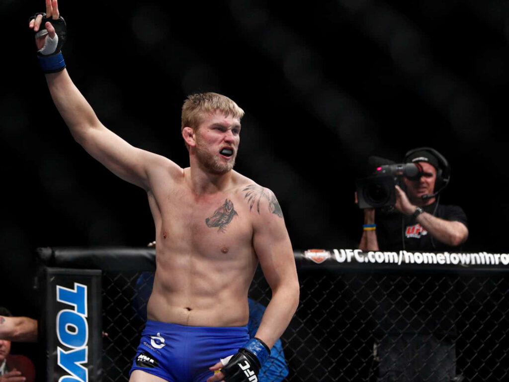 Alexander Gustafsson celebrates in UFC octagon powerful MMA fighter poster wallpaper background