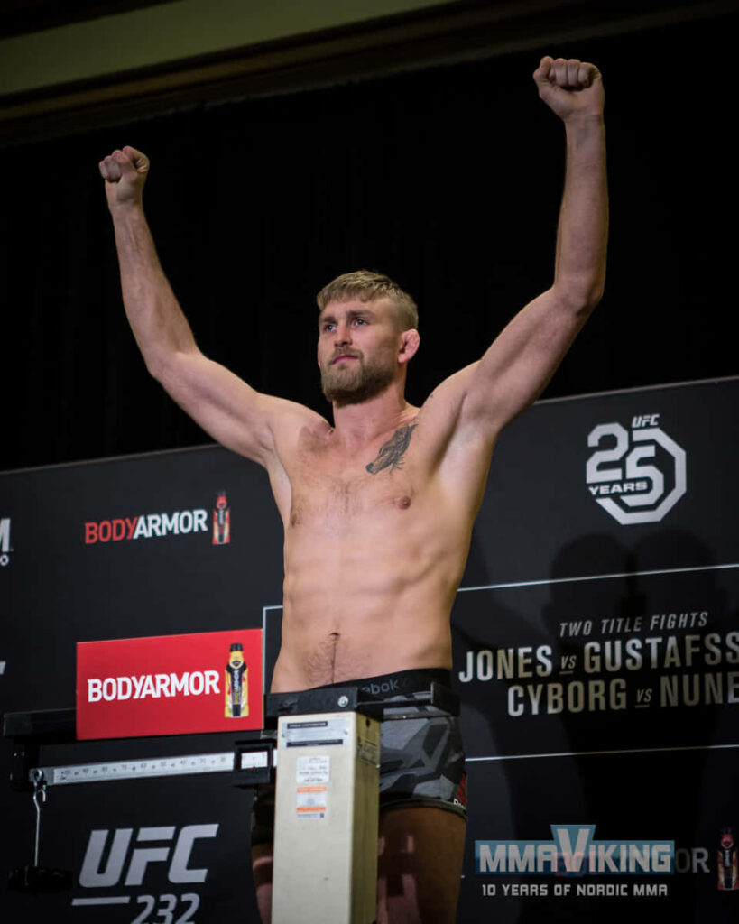 Alexander Gustafsson raising hands in victory at weigh-in showing determination and readiness Wallpaper