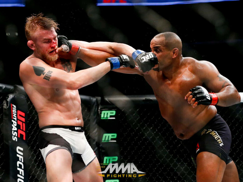 Alexander Gustafsson and Daniel Cormier intense MMA fight powerful striking in octagon wallpaper