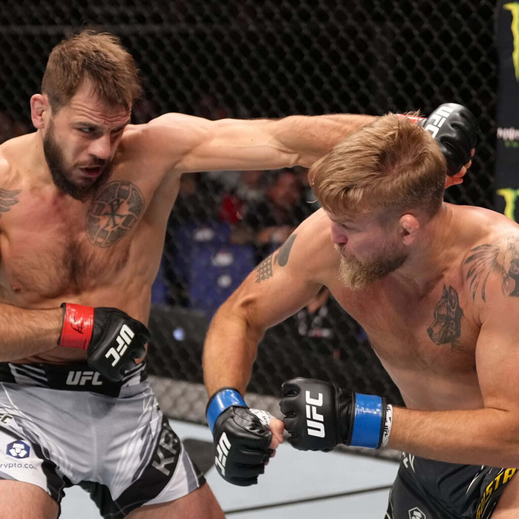 Alexander Gustafsson vs Nikita Krylov intense UFC fight showcasing strength and determination Wallpaper