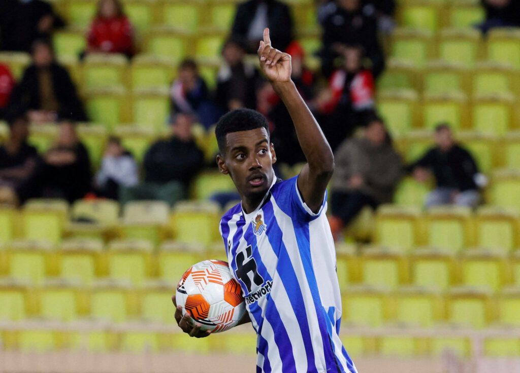 Alexander Isak in Real Sociedad kit celebrating on football field with fans in background wallpaper
