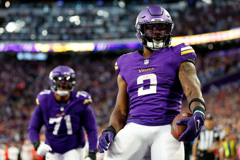 Alexander Mattison Minnesota Vikings celebrates in end zone energized stadium football wallpaper background