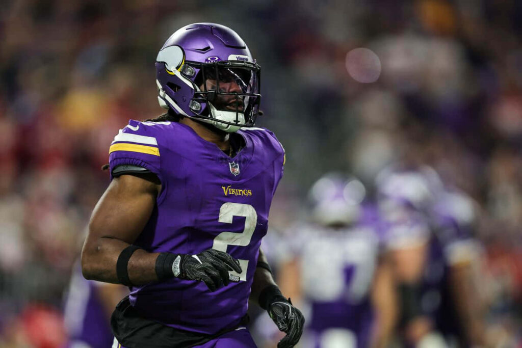 Alexander Mattison Minnesota Vikings running back intense action dynamic football wallpaper