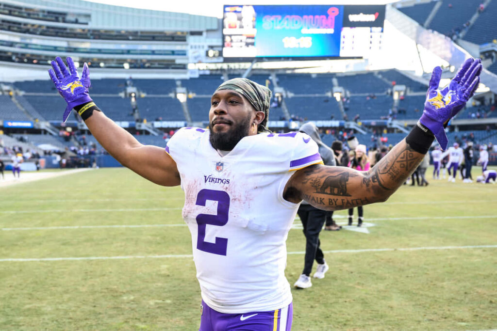 Alexander Mattison Minnesota Vikings celebrating victory on field showing passion and team spirit Wallpaper