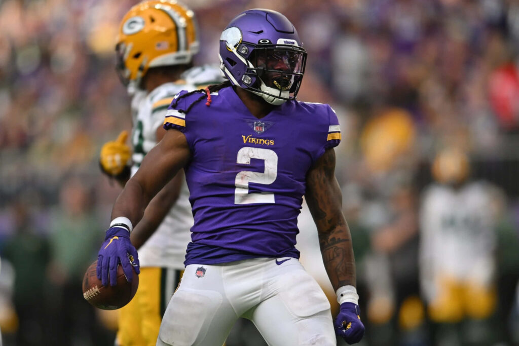 Alexander Mattison Minnesota Vikings number 2 jersey focused in action football wallpaper background
