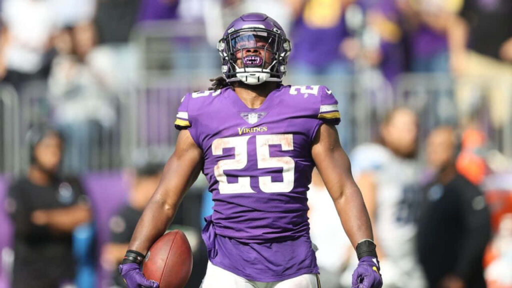 Alexander Mattison Vikings running back number 25 celebrating on field showing energy and power Wallpaper