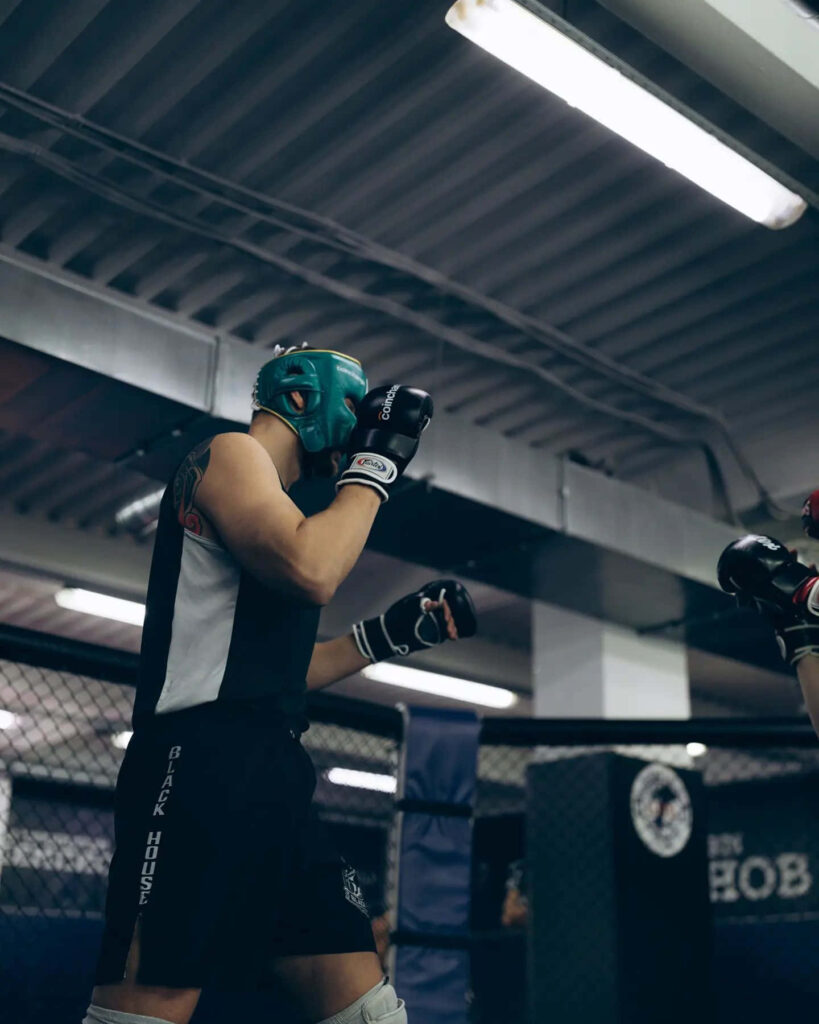 Alexander Volkov intense sparring training in warehouse gym showcasing focus and skill wallpaper