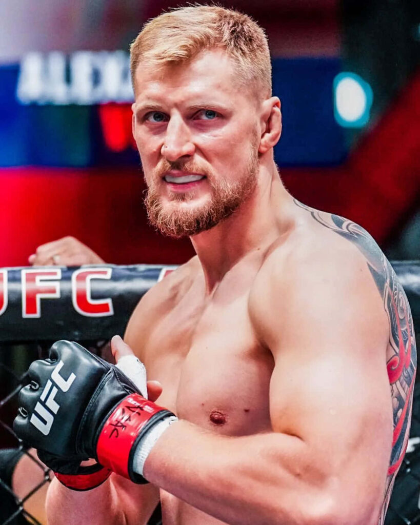 Alexander Volkov in UFC octagon showing intense focus and fierce fighting spirit wallpaper