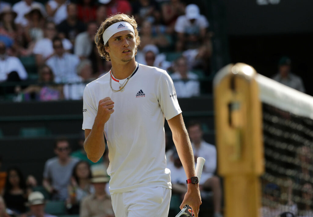 Alexander Zverev focused on Wimbledon tennis court mid-match intense determination wallpaper