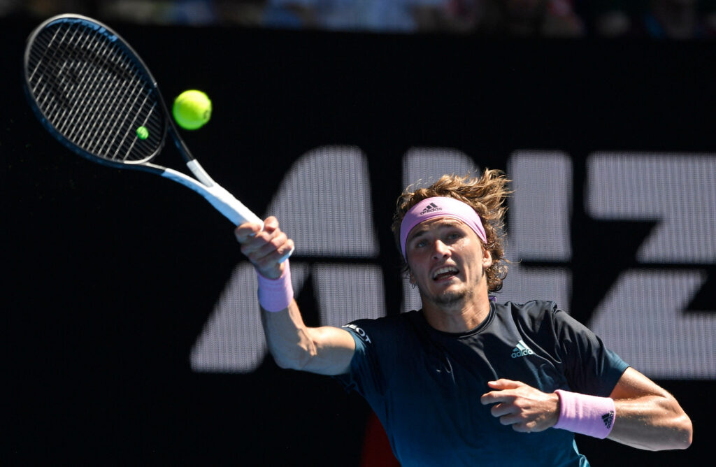 Alexander Zverev powerful tennis overhead smash athletic focused action on court wallpaper background