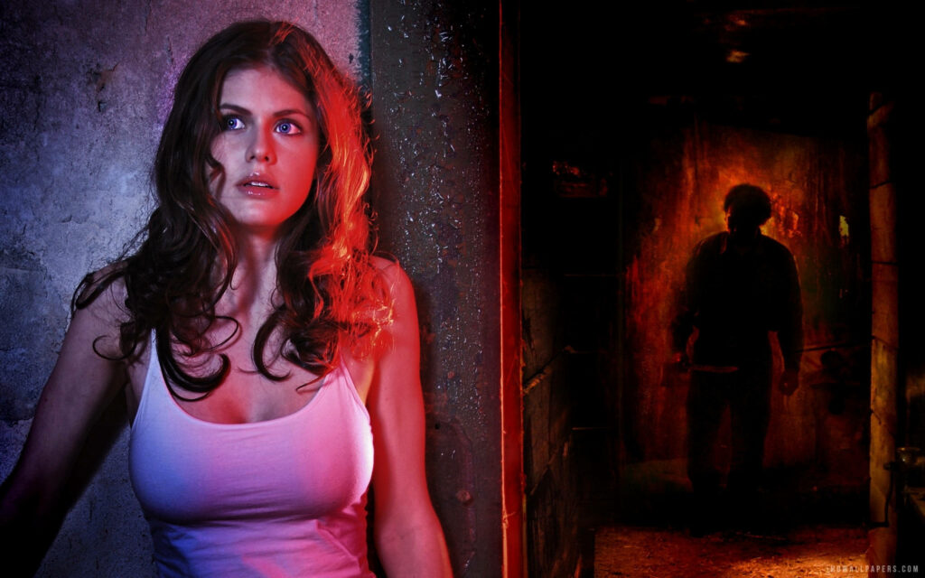 Alexandra Daddario tense against gritty wall with shadowy figure in thriller film Bereavement scene Wallpaper