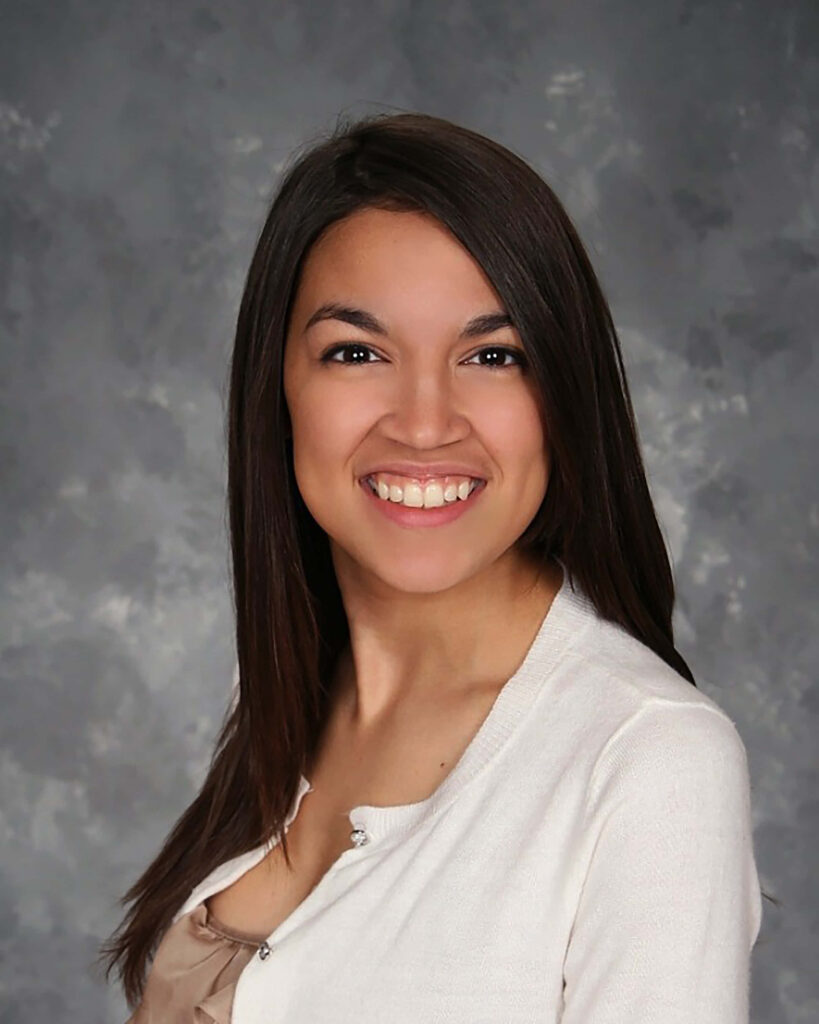 Alexandria Ocasio-Cortez smiling confidently with textured gray wallpaper background