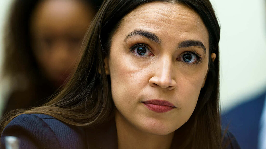 Alexandria Ocasio-Cortez serious focused expression intense attention determination portrait wallpaper