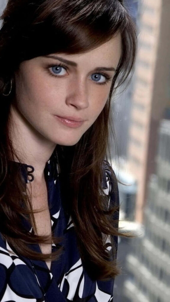 Alexis Bledel in chic patterned outfit with cityscape backdrop elegant modern wallpaper background