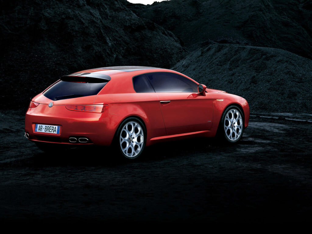 Alfa Romeo Brera red sports car sleek curves dramatic dark landscape dynamic wallpaper