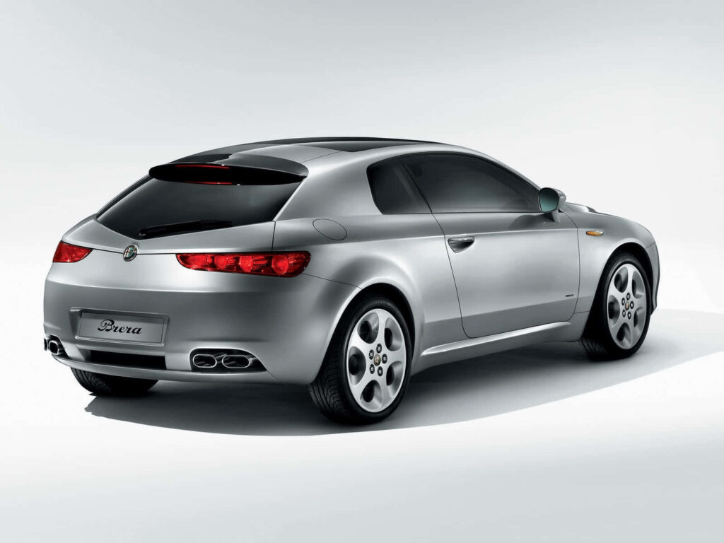 Silver Alfa Romeo Brera sports car in modern studio with stylish sleek design and wallpaper background